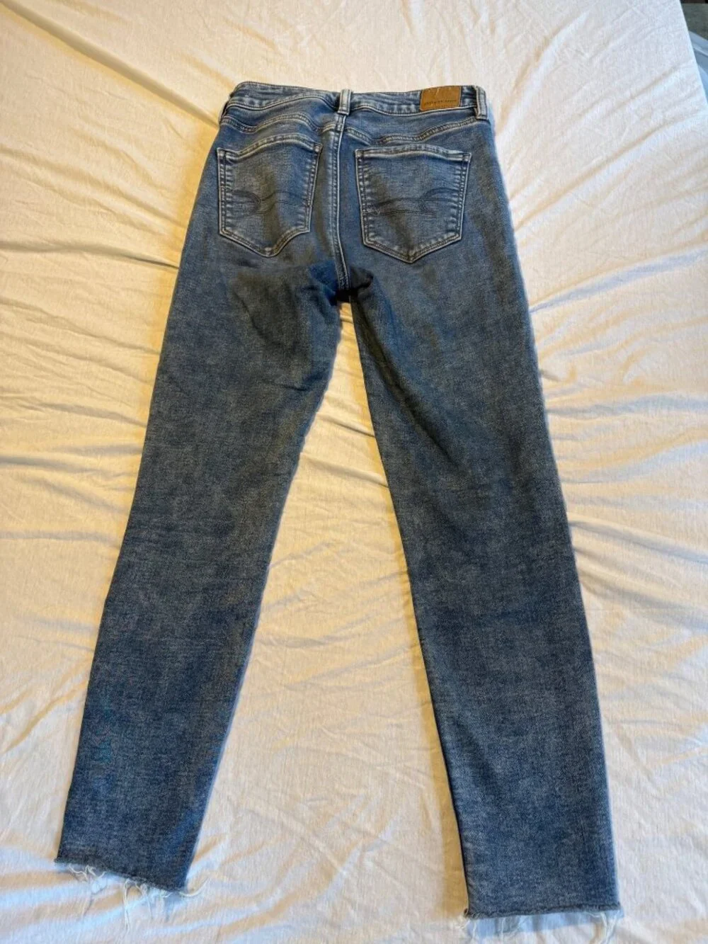American Eagle hi Rise Jeans Size 4 Medium Blue Cotton Spandex Jeggings Raw Hem